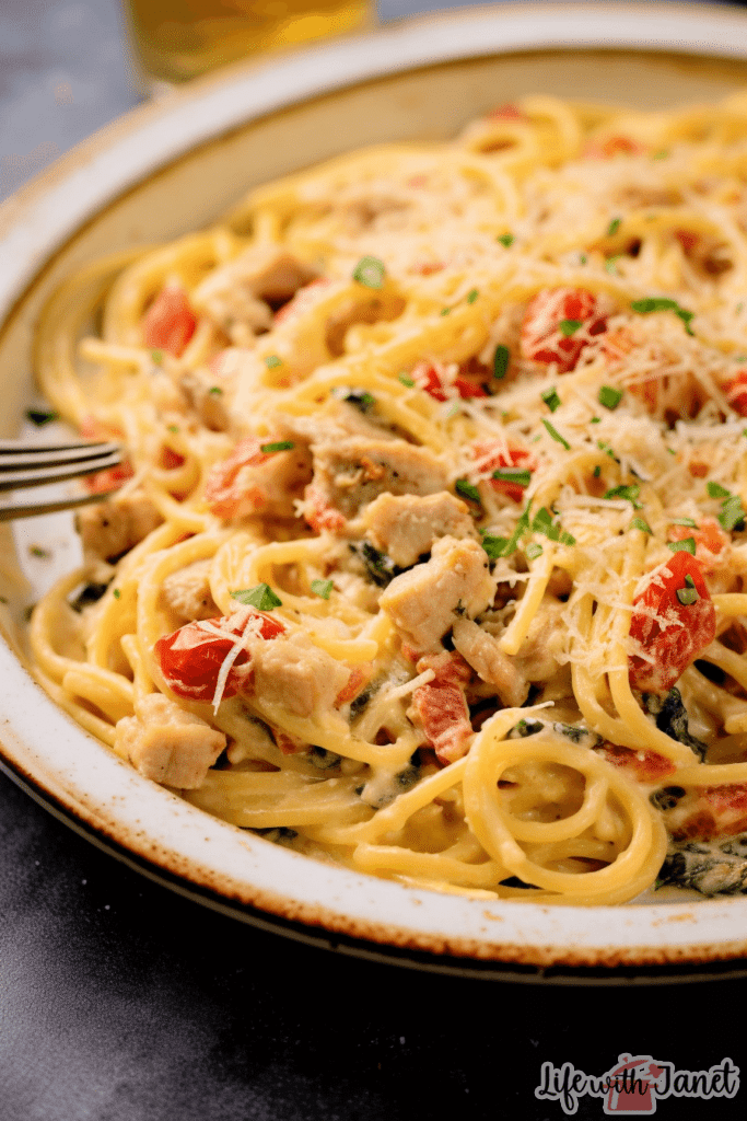 Baked Chicken Spaghetti Casserole in a ceramic dish, a perfect comfort food dish.