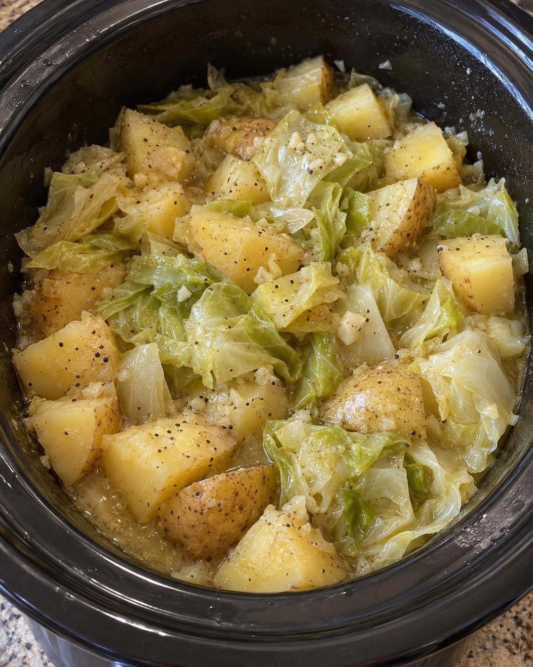 Slow Cooker Garlic Butter Cabbage & Potatoes in the main serving dish